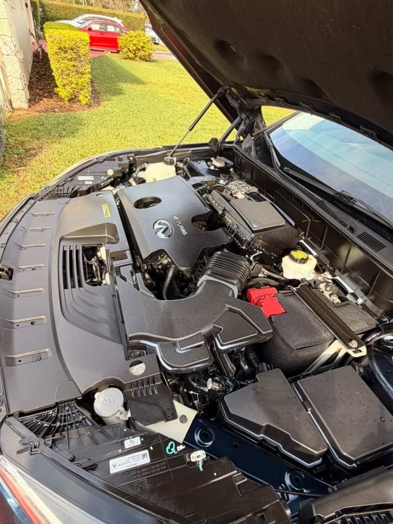 Detailed clean Infiniti VC-Turbo engine bay on an open hood