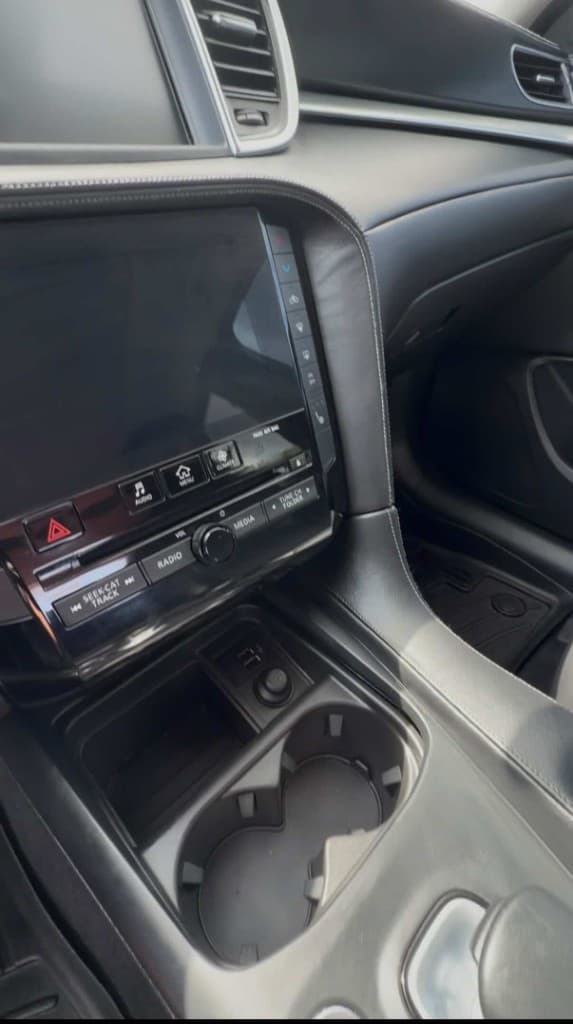 Clean luxury center stack and infotainment with leather trim after interior detail